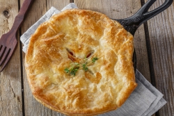 Algerian vegetable melange in a puff pastry on a wooden counter